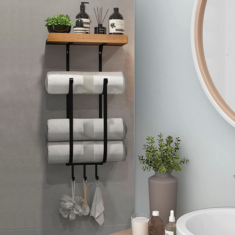 Wall outlet towel shelf